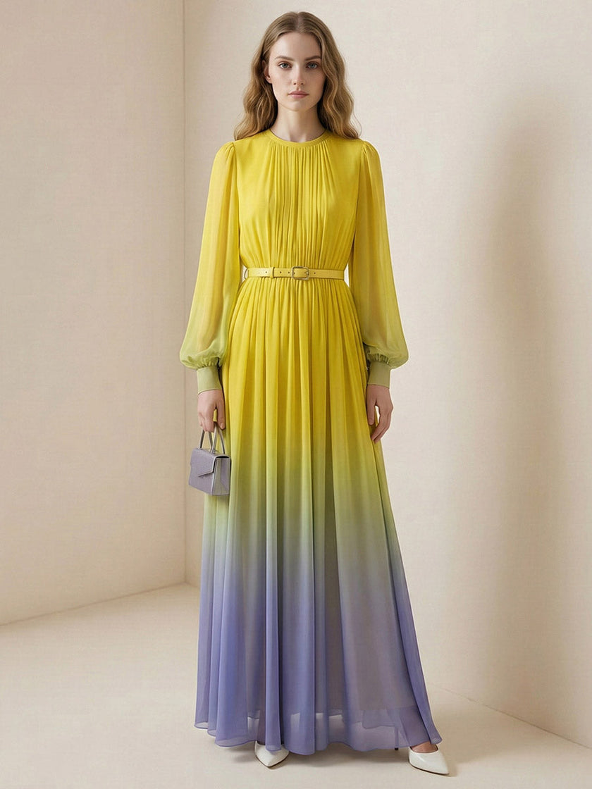 FJØRNA high waisted maxi dress with long sleeves, belt, contrast color gradient, pleated design, split joint, and round neckline.