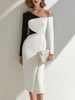 FJØRNA black and white asymmetrical one-shoulder midi dress, elegant knee-length dress with unique design and contrasting colors.