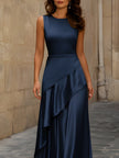 FJØRNA satin sleeveless maxi dress with asymmetric draping, elegant flowing fabric and stylish design perfect for formal occasions.