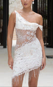 FJØRNA Amira Mini Dress in white, sleeveless with a fitted bodice and flared skirt, shown on a model.
