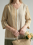 FJØRNA women's summer midi dress with striped pattern, long sleeves, and wrap design, perfect for warm weather.