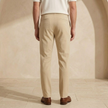 FJØRNA men's straight leg trousers with drawstring, relaxed fit, casual pants in neutral fabric, shown hanging or laid flat.