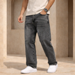 Relaxed fit men's denim jeans by FJØRNA, showing the casual blue pants with classic stitching and five-pocket design.