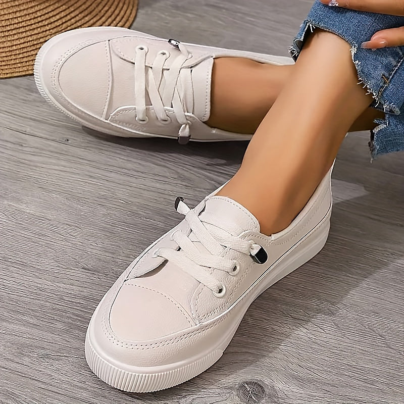FJØRNA Ava women’s orthopedic sneakers with supportive design, white and navy color, comfortable casual footwear for women.