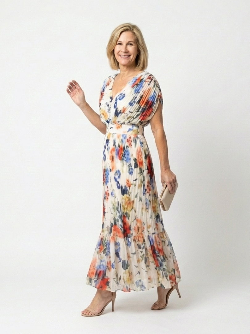 FJØRNA floral pleated summer midi dress for women, featuring a lightweight, flowy design with a vibrant floral pattern.