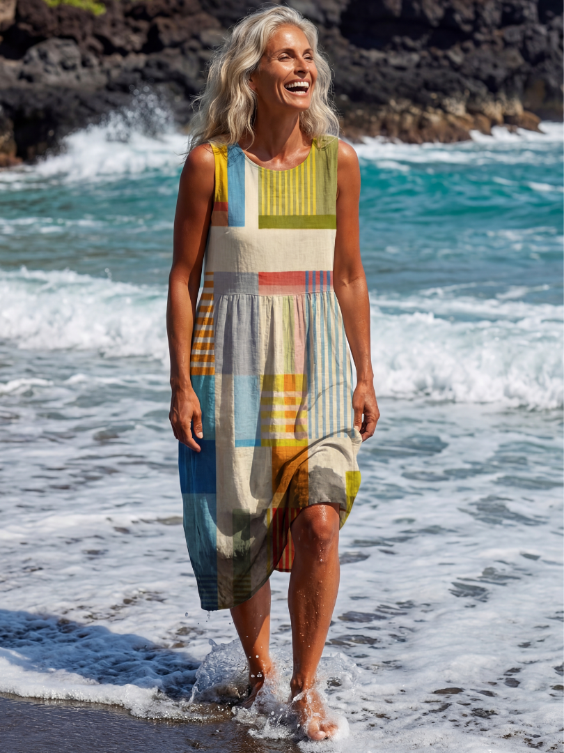 FJØRNA women's sleeveless summer midi dress with wrap design, flowy and breathable fabric, perfect for warm weather.