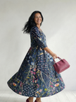 FJØRNA women's floral summer midi dress with long sleeves and wrap design, perfect for warm weather occasions.