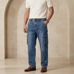 Men's FJØRNA elastic waist jeans, casual pants with a comfortable fit, shown in a front view with classic denim styling.