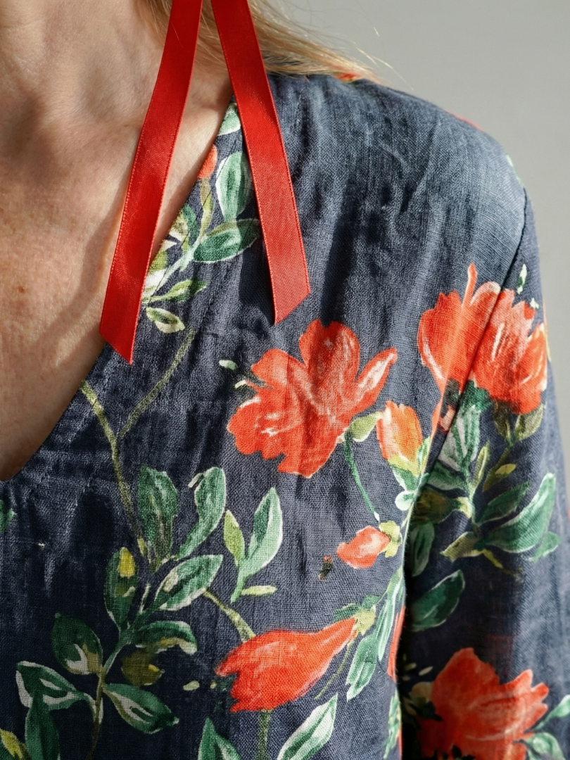 FJØRNA women's summer midi dress with floral pattern, long sleeves, wrap style, breathable fabric, perfect for warm weather.