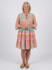 FJØRNA women's summer dress featuring a geometric tiered design with sleeveless style and vibrant pattern.
