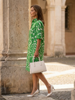 FJØRNA women's summer dress, lightweight wrap style with flowy fabric ideal for warm weather and casual outings.