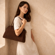 Large vegan suede handbag for women by FJØRNA, stylish and spacious with a soft texture and modern design.