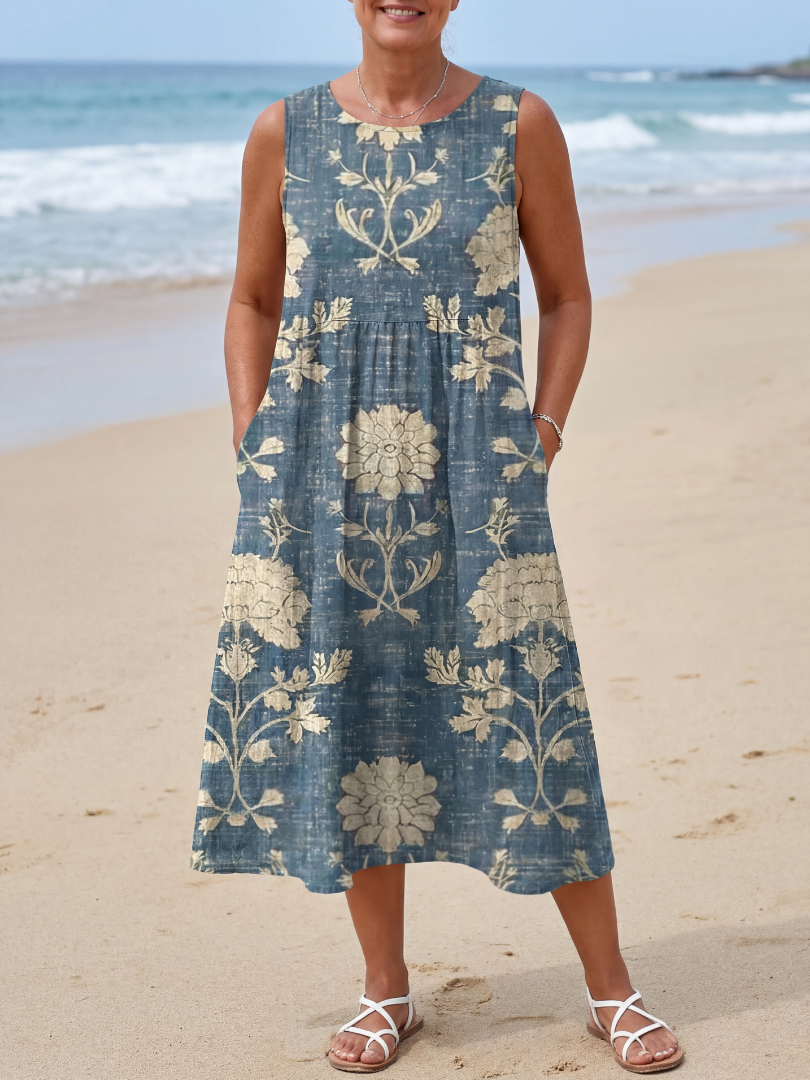 Floral sleeveless wrap summer midi dress for women by FJØRNA, featuring a feminine design and lightweight fabric.