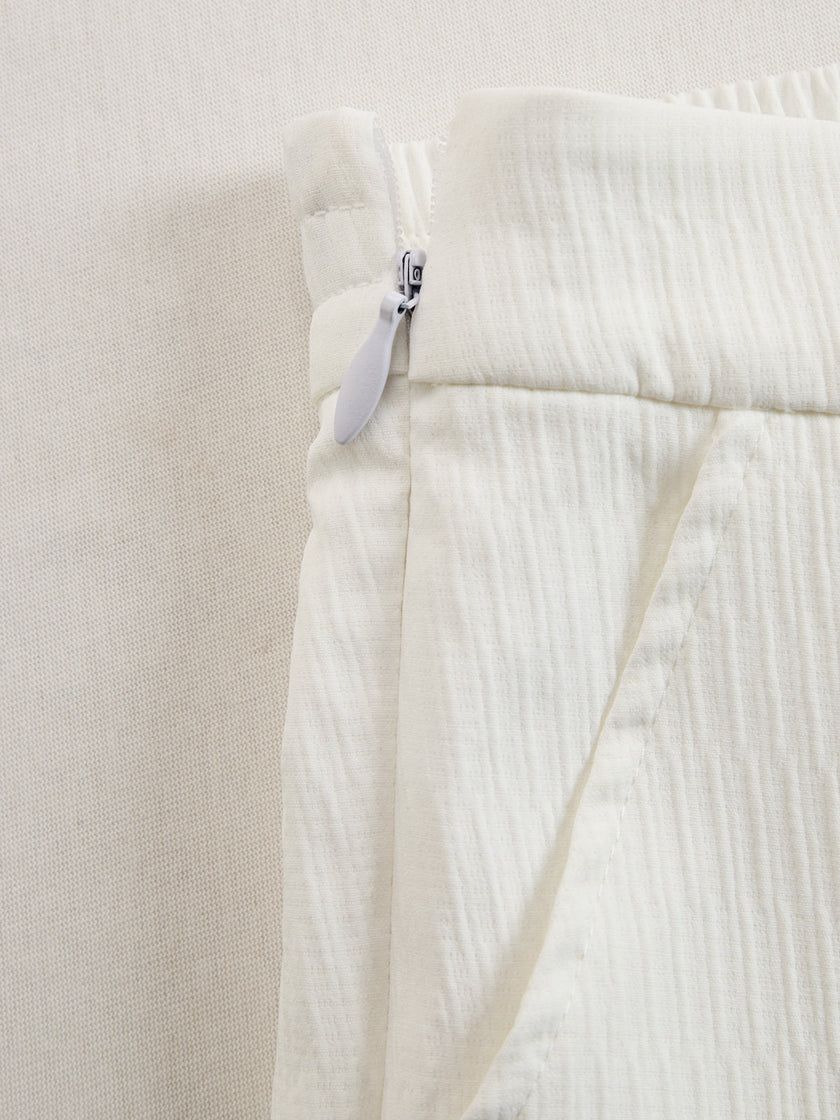 Cream textured lantern sleeve two-piece set by FJØRNA featuring stylish pants and top with lantern sleeves.