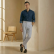 Men's high waist straight leg tailored trousers by FJØRNA, showing the fit and clean design of the stylish pants.