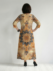 FJØRNA women's floral summer midi dress with long sleeves, flowy and breathable fabric, perfect for warm weather.