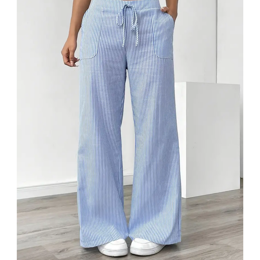 FJØRNA lightweight summer women's trousers with drawstring waist, pockets, and breathable fabric, ideal for warm weather.
