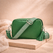 FJØRNA leather chevron strap genuine crossbody bag for women, showcasing its textured leather design and adjustable strap.