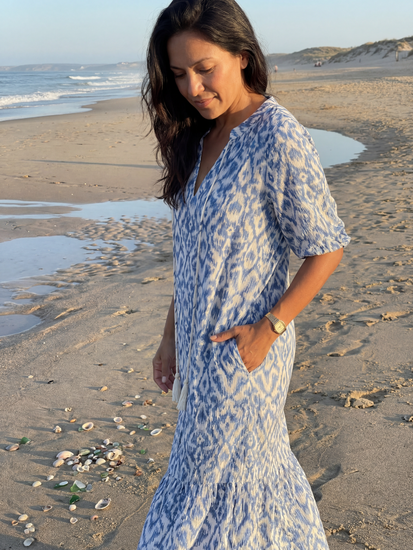 FJØRNA women's summer midi dress with geometric pattern, short sleeves, and wrap style, perfect for warm weather.