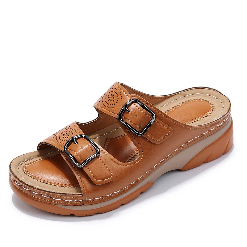 FJØRNA orthopedic comfort fit slide sandals with perforated open toe design and cushioned footbed for support.