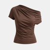 FJØRNA women's top, stylish casual blouse with long sleeves and a relaxed fit, worn by a model.
