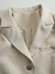 FJØRNA khaki belted waist two-piece trouser set with tailored pants and matching top, styled for a chic, modern look.