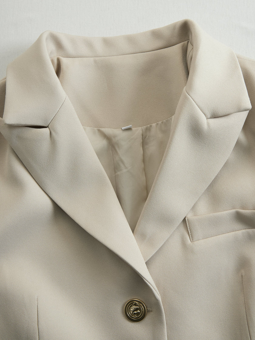 FJØRNA khaki belted waist two-piece trouser set with tailored pants and matching top, styled for a chic, modern look.