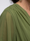 FJØRNA summer midi dress for women, flowy wrap design, lightweight and stylish for warm weather, seen in natural pose.