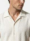 Close-up of FJØRNA men's short sleeve button-up shirt, showcasing the casual classic design and fabric details.