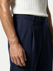 Close-up of men's straight fit trousers by FJØRNA showing tailored fabric and classic design in a neutral color.