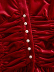 FJØRNA red velvet pleated ruffled long sleeve blouse with feminine design and detailed ruffle accents, showcasing elegant style.
