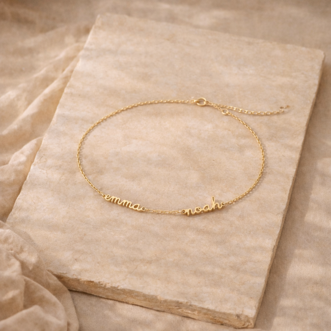 Gold personalized unisex ring from FJØRNA, close-up of engraved band showcasing custom details and sleek jewelry design.