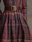 Brown FJØRNA maxi dress, casual style, flowing fabric, sleeveless design, full-length dress shown on model.