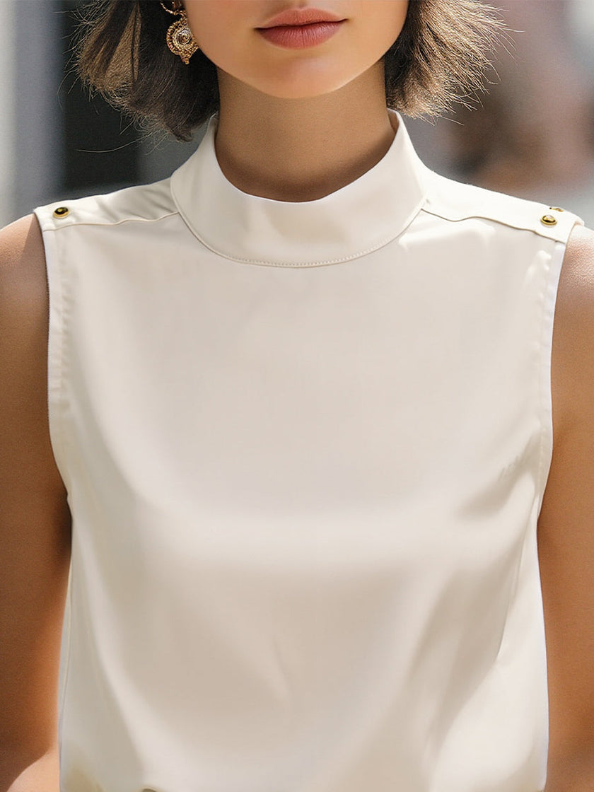Ivory satin sleeveless blouse for women with high neck, stylish FJØRNA top, elegant and smooth fabric detail visible.