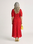 FJØRNA women's summer midi dress with floral print, square neckline, puff sleeves, and a flowing silhouette.