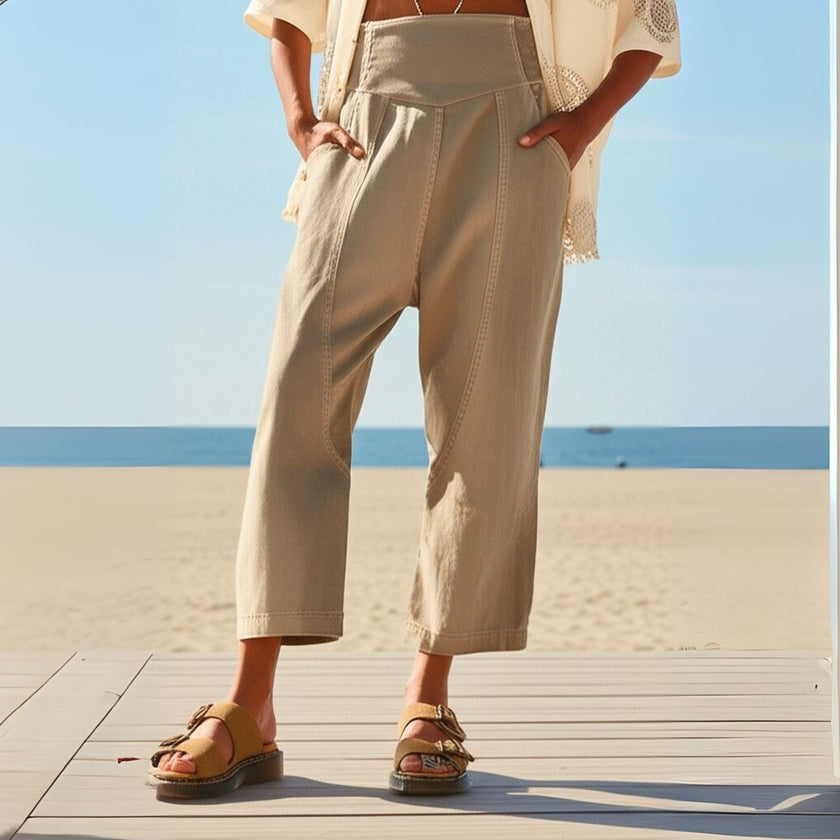 Women’s FJØRNA wide-leg denim jeans, stylish high-waisted pants with a relaxed fit, displayed on a neutral background.