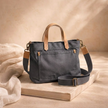 Large FJØRNA canvas messenger bag for women with adjustable strap and spacious interior, casual style for everyday use.