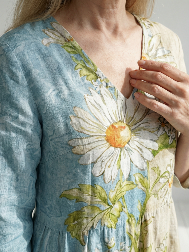 FJØRNA women's summer midi dress with long sleeves, flowy fabric, and a relaxed, elegant silhouette in soft pastel color.