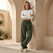 Men's FJØRNA corduroy wide leg trousers with relaxed fit, showing the soft ribbed fabric and stylish wide-leg design.