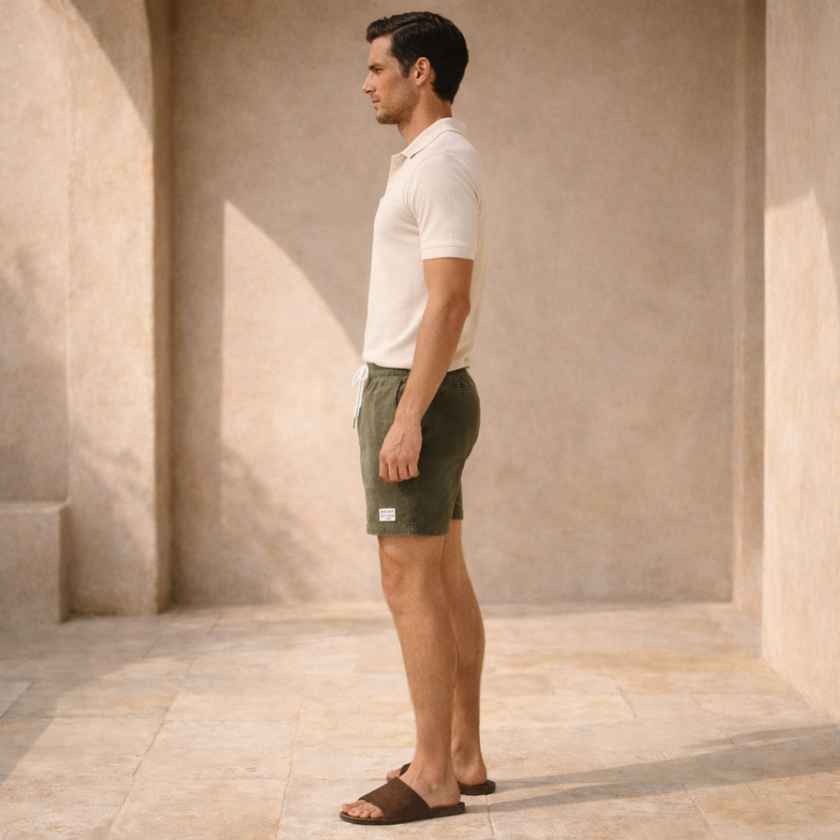 Men's FJØRNA corduroy shorts with drawstring waist, shown in a casual fit with front pockets and textured fabric.
