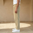 Men’s straight leg corduroy trousers by FJØRNA, casual pants with textured fabric and classic fit, shown in a neutral color.