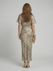 FJØRNA women's summer midi dress with colorful print, short sleeves, and flowing fabric for a stylish warm-weather look.