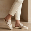 Red sheepskin slip-on sandals for women by FJØRNA, featuring a cozy, plush sheepskin design and comfortable open-toe style.