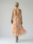 FJØRNA women's summer midi dress with halter neck and sleeveless design, stylish and comfortable for warm weather.