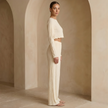 Women’s soft knit lounge co-ord set by FJØRNA featuring a cozy, stylish matching top and pants in neutral tones.