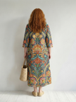 FJØRNA women's summer midi dress with long sleeves, wrap style, flowy lightweight fabric, perfect for warm weather.