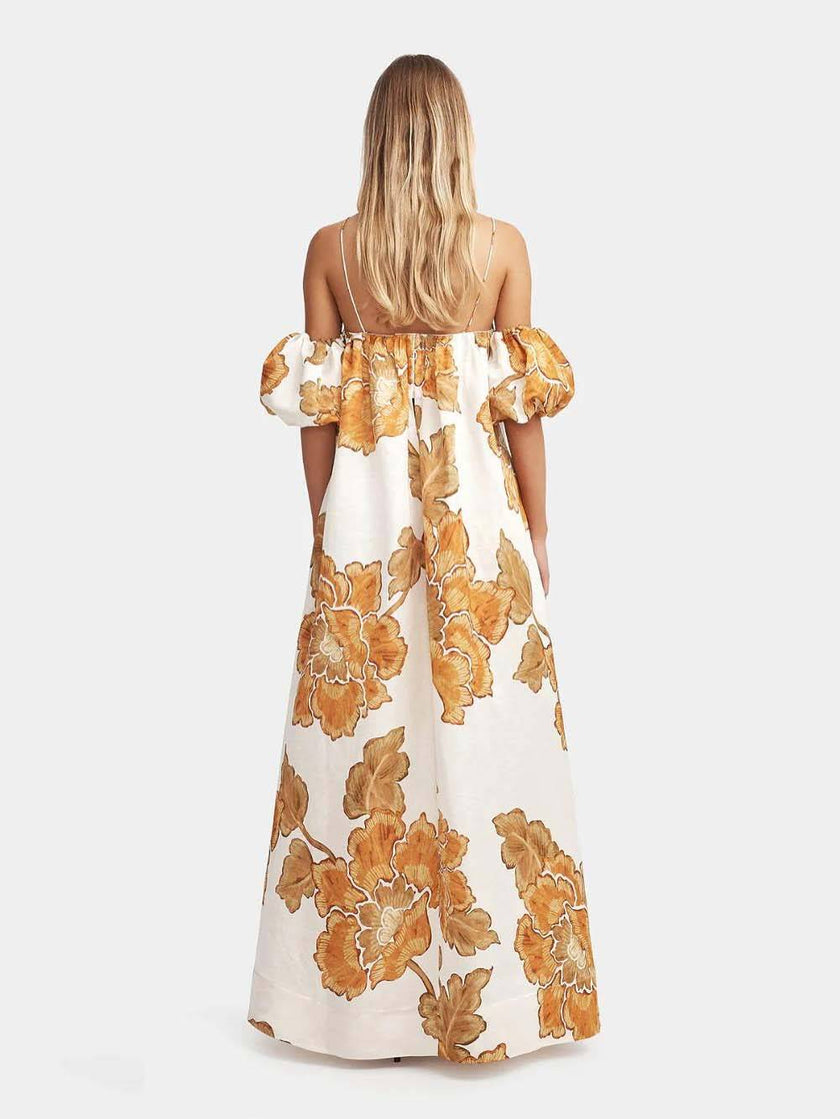 FJØRNA floral print sling dress in mini, midi, and maxi lengths, featuring a feminine design and vibrant floral pattern.