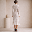 Ivory lace midi dress for women with high neck, stylish and elegant, by FJØRNA, displayed on a model.
