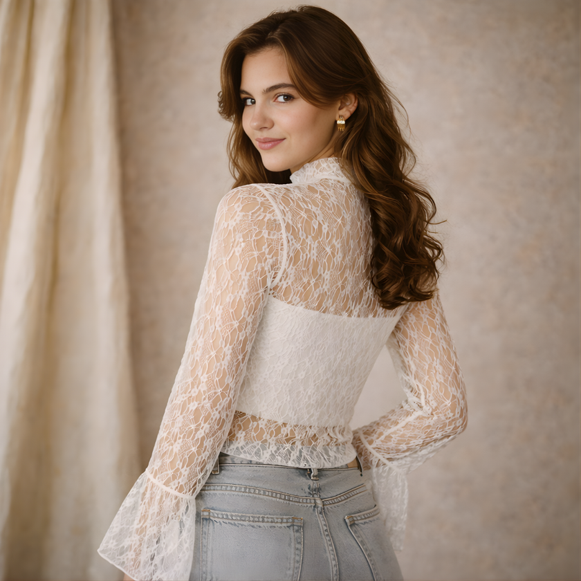 FJØRNA women's lace top with a mock neck, featuring intricate lace details and a stylish fit, perfect for fashionable occasions.