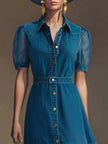 Blue denim V-neck short-sleeved organza maxi dress for women by FJØRNA, featuring a flowing silhouette and elegant fabric details.